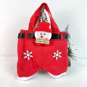 Detailed close-up of a festive red felt Christmas gift bag featuring a 3D snowman and belt