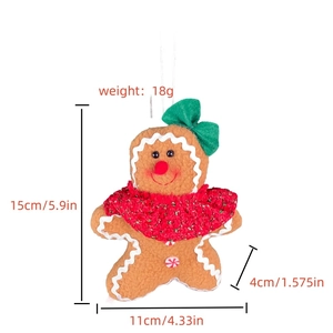 Detailed size specifications of gingerbread man plush pendant with red cape and green bow
