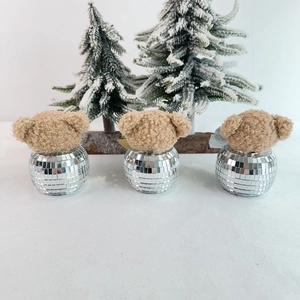 Three plush teddy bear heads on silver disco ball bases for festive Christmas tabletop decor