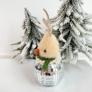 Detail of wool felt Christmas elk with disco ball base and green knit scarf