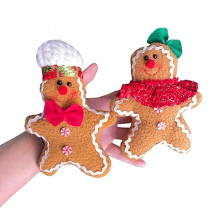 Plush Gingerbread Man Christmas Tree Ornaments with festive hats and scarfs on white background