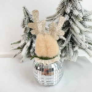 Detail of reindeer ornament with golden glitter antlers and silver disco ball base