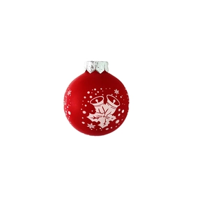 Detail of red Christmas ornament ball with white snowflake and bell patterns on white backdrop