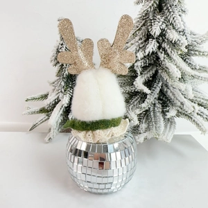 Close-up of a Christmas deer ornament with a mirror disco ball base and plush body