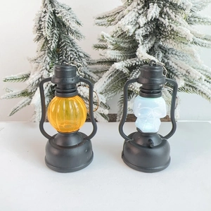 Miniature LED Halloween lantern set featuring orange pumpkin and white skull motifs