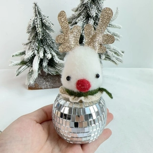 Close-up of a handmade Disco Reindeer ornament with mirror tiles and white felt details