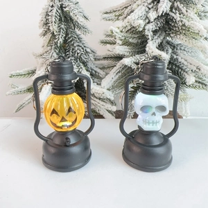 Halloween LED lanterns set with pumpkin and skull designs on festive snowy background