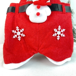 Detail of Christmas Santa trousers gift bag with plush snowman and felt texture