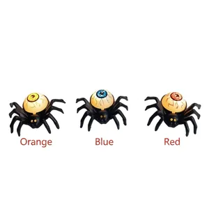 Halloween spider LED tea light with glowing colorful eyeballs in orange, blue, and red