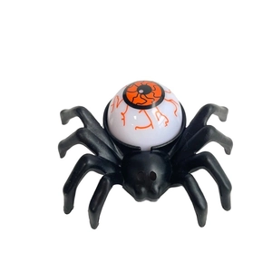 Macro shot of Halloween spider LED light with a detailed bloodshot eyeball on top