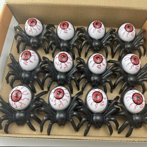 Detailed set of 12 Halloween spider eyeball decorations with red veins in shipping box