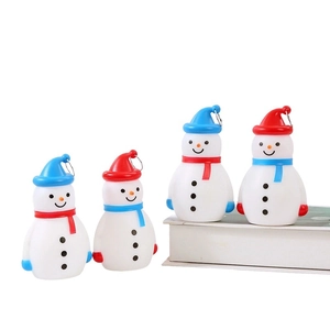 Close-up of four LED snowman figurines with colorful hats and metal hanging rings
