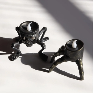 Gothic skull and skeleton hand LED candle holders with antique gold metallic finish
