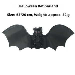 Close-up of black Halloween tinsel bat hanging decoration with red eyes, size 63x20cm