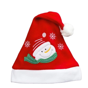 Detail of red velvet Christmas hat featuring an embroidered snowman and snowflake pattern