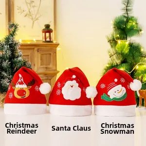 Close-up of plush Christmas hats featuring embroidered elk, Santa, and snowman patterns