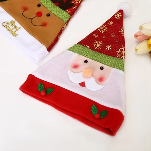 Detail of Christmas hats featuring reindeer and Santa Claus with gold Merry Christmas text