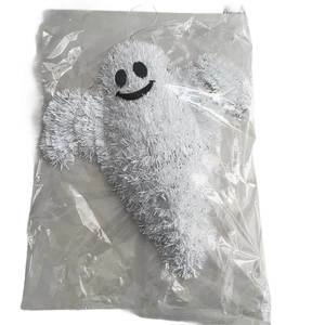 Detailed view of a white tinsel ghost hanging ornament for Halloween party door decoration