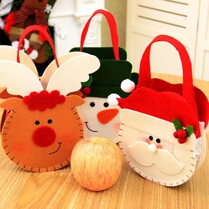 Detail of Christmas felt gift bags with reindeer, snowman and Santa Claus designs