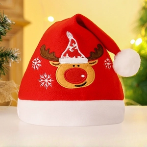Close-up of red velvet Christmas hat featuring reindeer and snowflake embroidery details