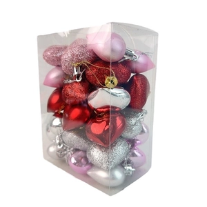 Assorted heart ornaments in shiny, velvet, and glitter finishes within a clear storage box