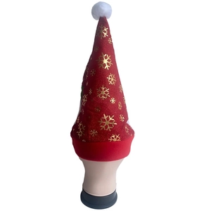 Classic red Christmas hat with gold snowflakes and plush white pom pom on a model stand