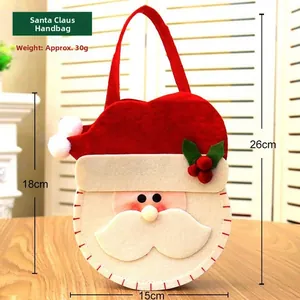 Detailed size view of Santa felt candy bag showing 18x15cm dimensions on wood surface