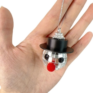 Disco ball snowman Christmas ornament with black top hat and mirror mosaic face detail