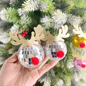 Close-up of reindeer disco ball ornament with silver mirrors and golden antlers