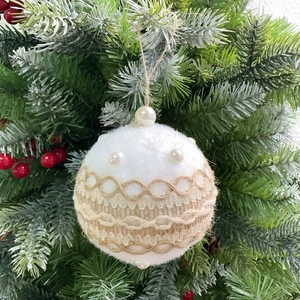 Close-up of white plush Christmas ball ornament with burlap lace and pearl details
