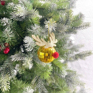 Golden disco ball reindeer ornament with glitter antlers hanging on a Christmas tree