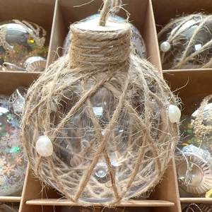Detail of rustic 8cm Christmas ball with jute twine net and elegant pearls decoration