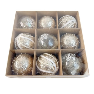 Set of 9 gold and champagne Christmas balls in kraft box featuring glitter and snowflakes