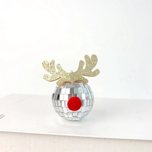 Close-up of disco ball reindeer ornament with silver mirrors, golden antlers and red nose
