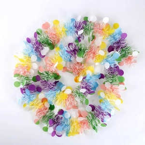 Colorful festive tinsel garland with vibrant decorative discs for holiday party venue decor