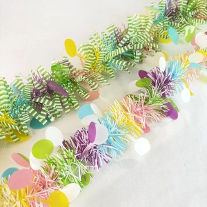 Close-up of colorful Easter tinsel garlands with sparkling metallic foil sequins