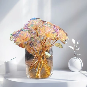 Detailed macro view of colorful iridescent artificial roses in a glass vase gift decor