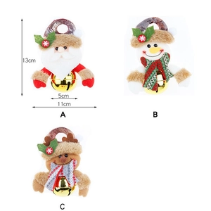 Detailed view of Christmas plush ornaments featuring Santa, snowman, and reindeer with bells