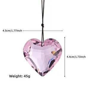 Pink heart-shaped crystal pendant showing detailed dimensions and faceted glass cuts