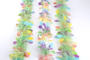 Detail of colorful Easter tinsel garlands with oval sequins and high density fringe
