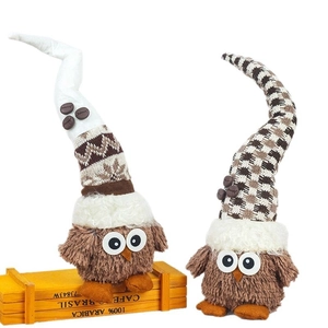 Cute coffee bean owl gnome plush doll decoration with a pointed knitted hat on a wooden box