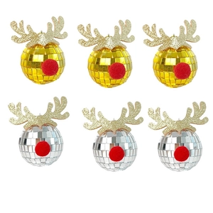 Close-up of disco ball ornaments with gold reindeer antlers and red plush noses for Christmas