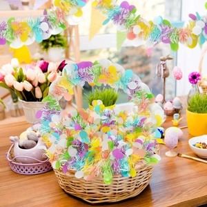 Detail of colorful Easter tinsel garland with fringe and sequins on a willow basket