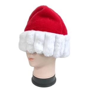 Detail of plush Santa hat featuring thick white faux fur brim and vibrant red velvet fabric