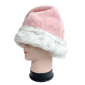 Nahaufnahme des dicken rosa und weißen Webpelzmaterials der flauschigen Weihnachtsmütze