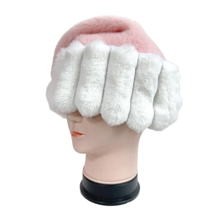 Detail of pink faux fur Santa hat with thick white plush brim on a display mannequin