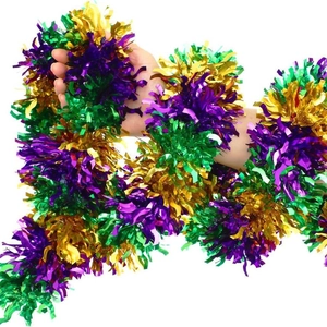 Detail of metallic purple, green and gold tinsel garland for festive party decoration