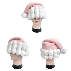 Pink and white plush Santa hat with textured brim and fluffy pompom from three angles