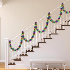Close-up of fluffy purple, gold, and green Mardi Gras tinsel garland on a staircase