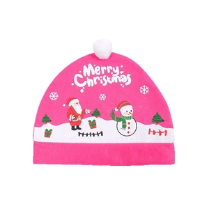 Detail of pink plush Christmas car seat cover with white pom-poms and holiday patterns